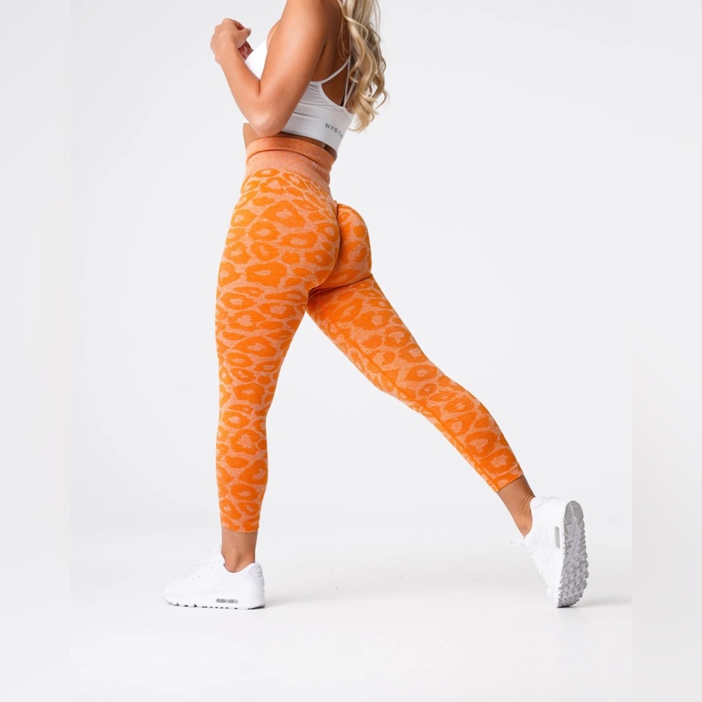 NVGTN burnt orange leopard leggings in size XS